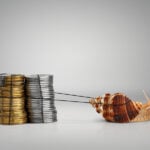 A snail pulls a pile of coins