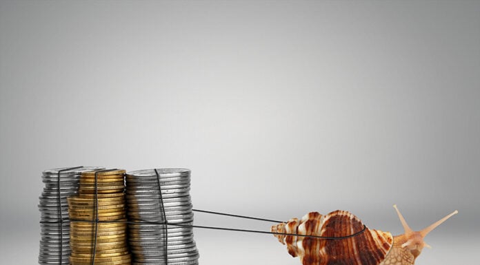 A snail pulls a pile of coins