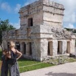 tourists observing ruins in Mexico
