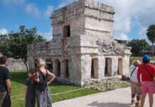 tourists observing ruins in Mexico