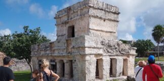 tourists observing ruins in Mexico