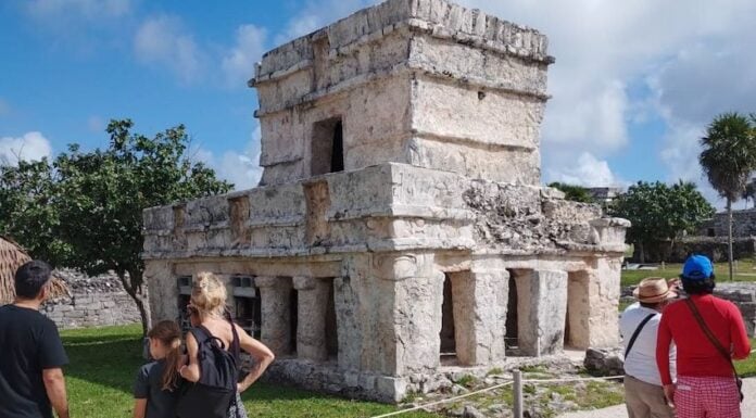tourists observing ruins in Mexico