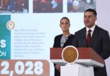 Omar García Harfuch at a podium