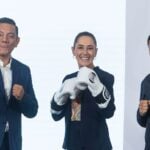 Sheinbaum poses with professional boxers Cristian Mijares and Isaac Jonathan Cruz González "El Pitbull" during her Feb. 16 press conference