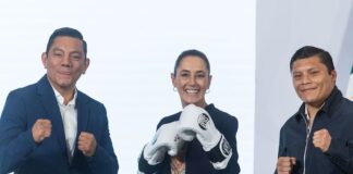 Sheinbaum poses with professional boxers Cristian Mijares and Isaac Jonathan Cruz González "El Pitbull" during her Feb. 16 press conference
