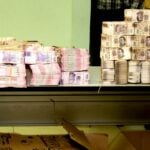 stacks of peso bills signaling corruption