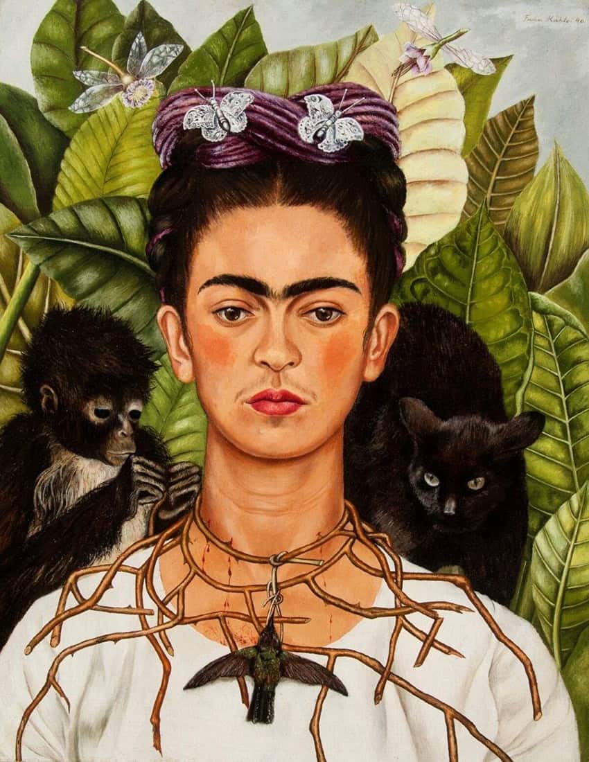 A Frida Kahlo painting showing the artist with a monkey, a black cat, and a hummingbird hanging from a thorn necklace.