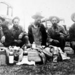 Black and white photos of Mexican tequileros caught on the border in Texas in the 1920s. The three tequileros are posed with two border authorities with the confiscated sacks of alcohol in front of them.