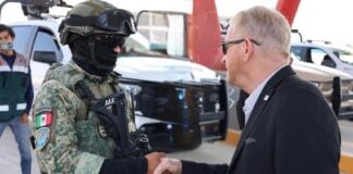 Ambassador to Mexico Ron Johnson shaking the hand of a Mexican soldier