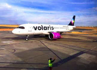 A Volaris airplane on an aiprot runway