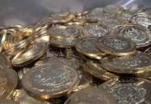 A pile of 10-peso Mexican coins