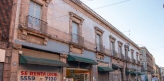 Mexico City, Mexico – August 15, 2020: Empty streets while the Covid pandemic took on the city and posters warning people to stay inside their houses