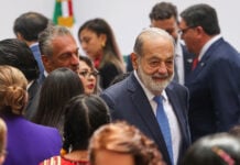 Mexican billionaire Carlos Slim Helú and his son in a crowd at the Mexican National Palace