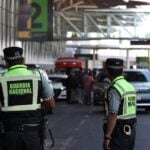 National Guardsmen watch cars pull up to terminal 2 of Mexico City International Airport