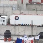 impounded truck where over 200 migrants were traveling