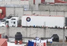 impounded truck where over 200 migrants were traveling