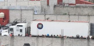 impounded truck where over 200 migrants were traveling