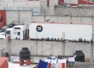 impounded truck where over 200 migrants were traveling