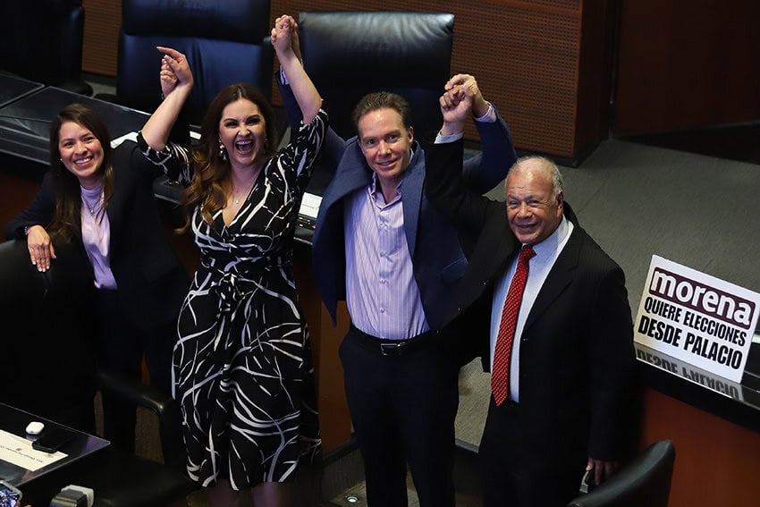 Senators hold hands in the air