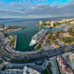 An aerial fisheye view of a massive cruise ship at dock in Puerto Vallarta