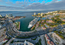 An aerial fisheye view of a massive cruise ship at dock in Puerto Vallarta