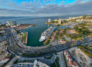 An aerial fisheye view of a massive cruise ship at dock in Puerto Vallarta