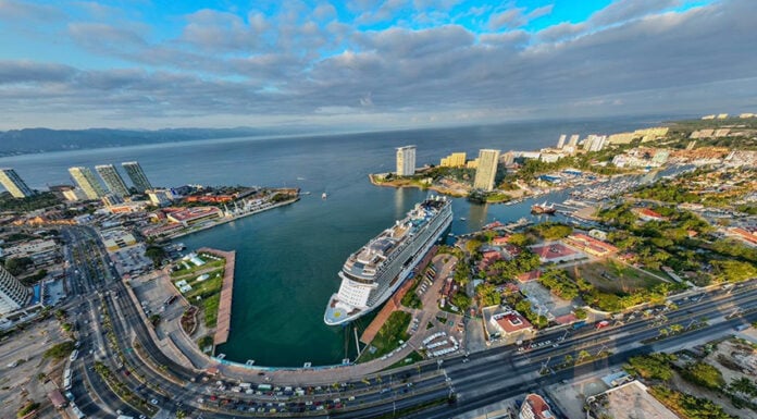 An aerial fisheye view of a massive cruise ship at dock in Puerto Vallarta