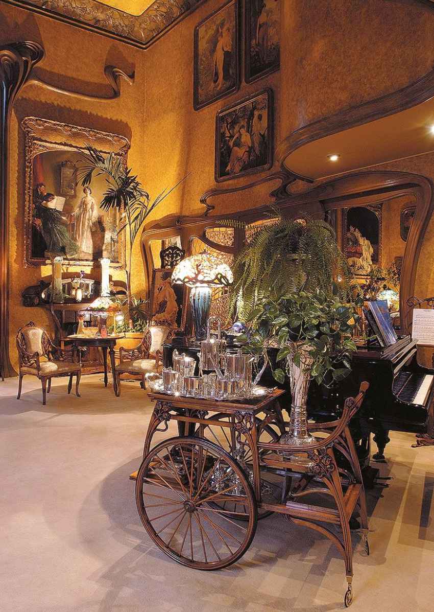 Interior shot of Casa Holtz, decorated in lavish Art Nouveau style with multiple early 20th century traditional figurative portraits of owners Ignacio Holtz and his wife Beatriz Mendivil.