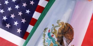 Flags of Mexico and the U.S. shown at a civic event