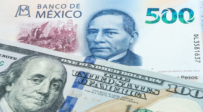 A 100-US dollar bill and a 500-Mexican peso bill