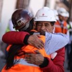 The father of Jose Ángel Hernandez Vélez, one of 9 miners who had gone missing and were later found dead in a clandestine grave, receives a hug from a fellow miner during a march for justice in Zacatecas in February.