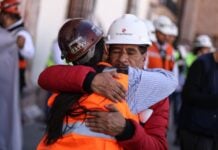The father of Jose Ángel Hernandez Vélez, one of 9 miners who had gone missing and were later found dead in a clandestine grave, receives a hug from a fellow miner during a march for justice in Zacatecas in February.