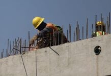Mexican construction worker on a wall