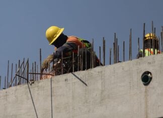 Mexican construction worker on a wall