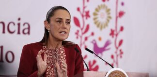 Sheinbaum at podium on April 7, 2026