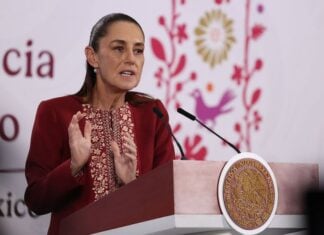 Sheinbaum at podium on April 7, 2026