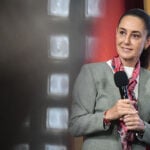 President Sheinbaum holds a microphone