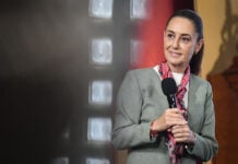 President Sheinbaum holds a microphone