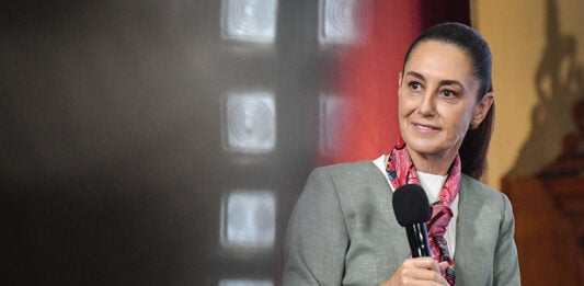 President Sheinbaum holds a microphone