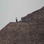Security agents atop a pyramid at Teotihuacán, Mexico