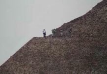Security agents atop a pyramid at Teotihuacán, Mexico