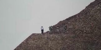 Security agents atop a pyramid at Teotihuacán, Mexico