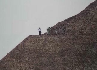 Security agents atop a pyramid at Teotihuacán, Mexico