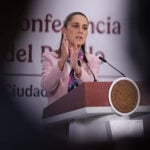 President Sheinbaum gestures from the podium of her morning press conference