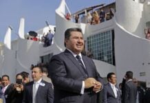 Nassón Joaquín García, shown here welcoming guests from 54 countries to a convicatiuon of his