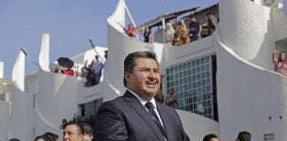 Nassón Joaquín García, shown here welcoming guests from 54 countries to a convicatiuon of his