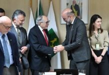 Mexico's Health Minister David Kershenobich shakes hands with colleagues during a work trip to Brazil