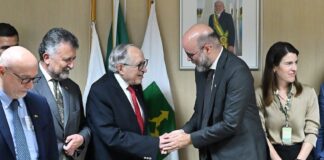 Mexico's Health Minister David Kershenobich shakes hands with colleagues during a work trip to Brazil