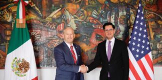 Ambassador Johnson shaking hands with Foreign Affairs Minister of Mexico Roberto Velasco