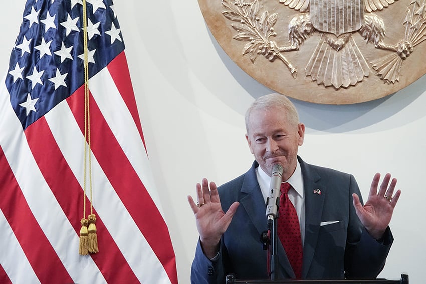 U.S. Ambassador to Mexico Ronald Johnson with an American flag